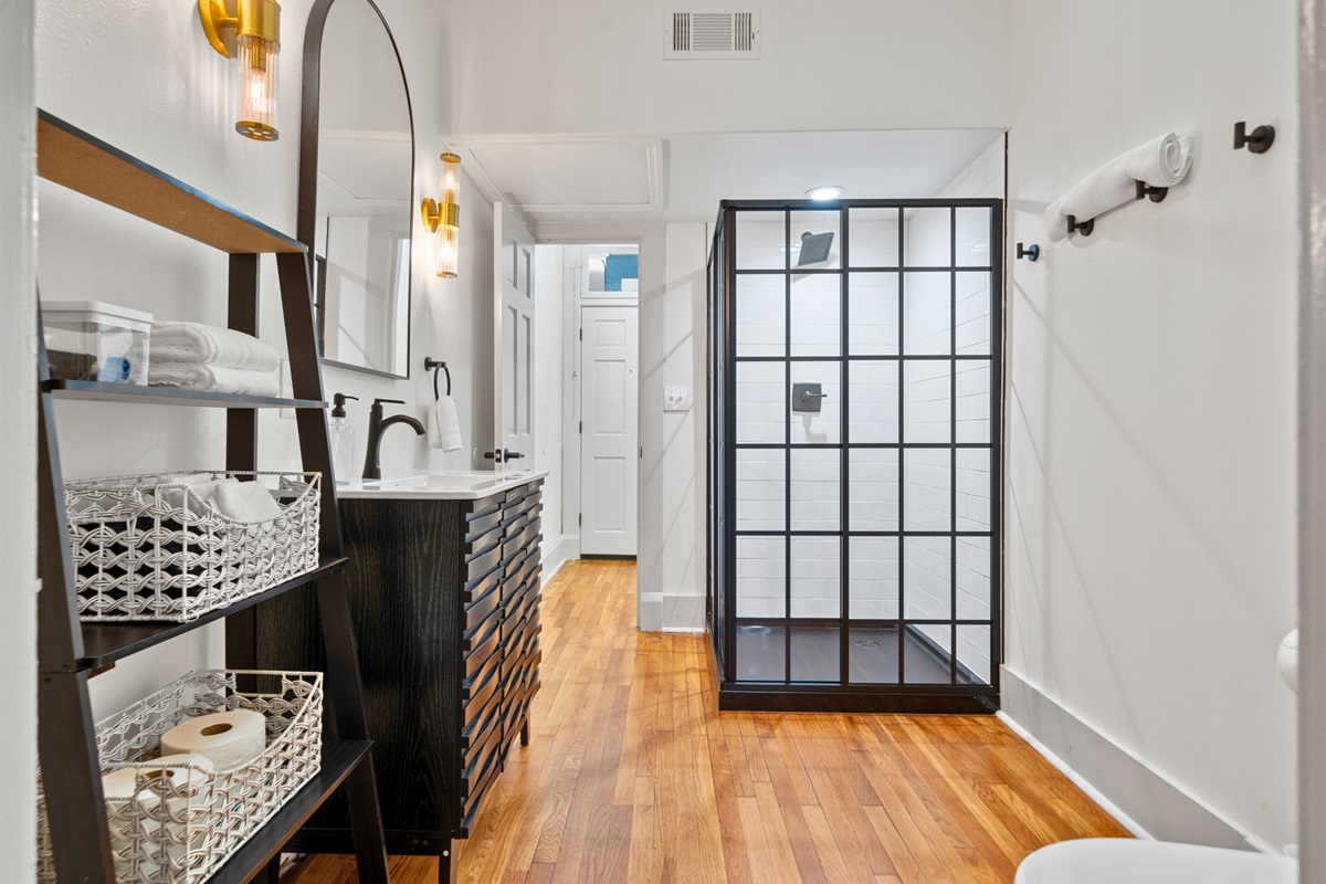 The vanity area offers sleek design and plenty of room for getting ready in style and comfort.