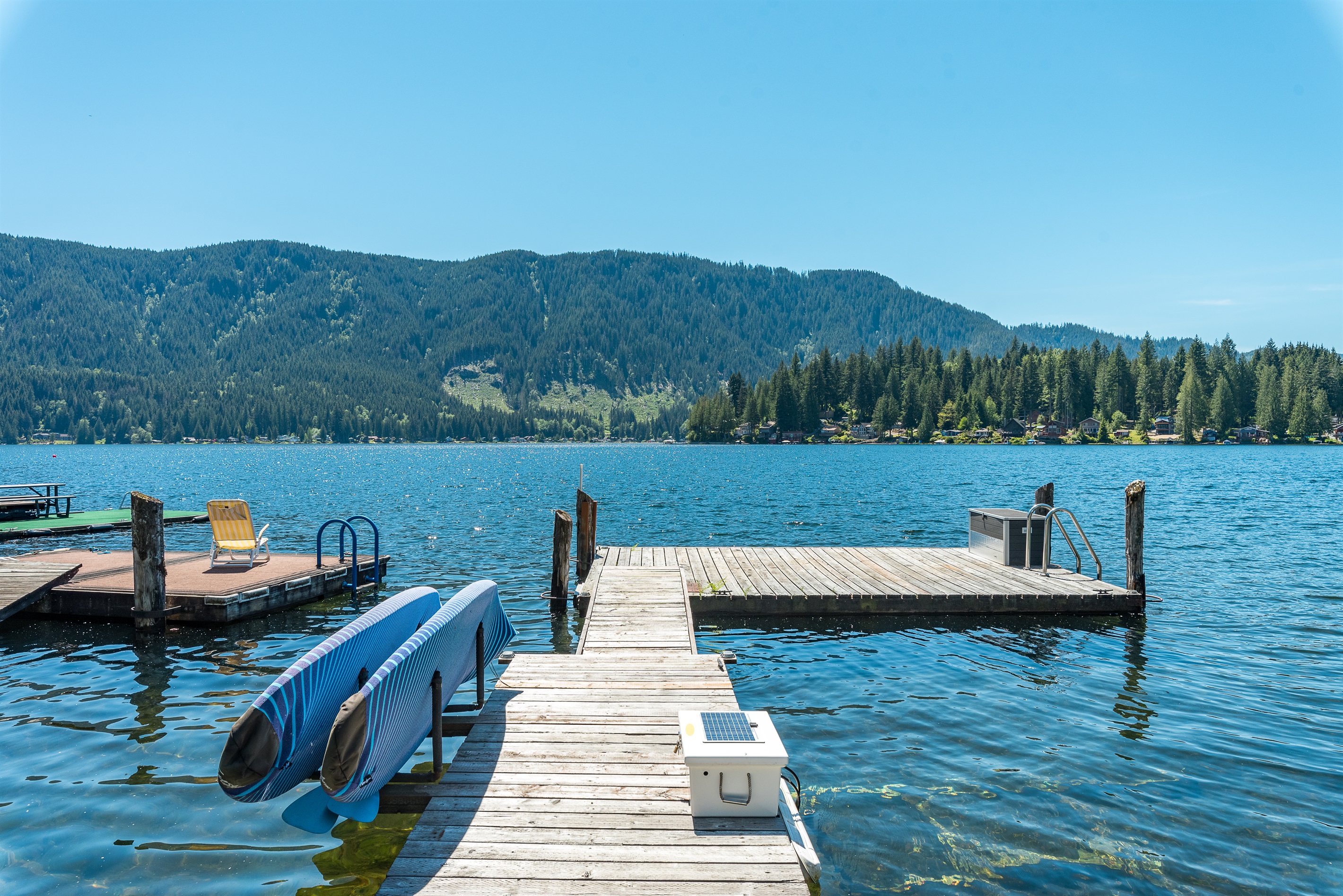 Dock with two stand up paddle boards available for your use.