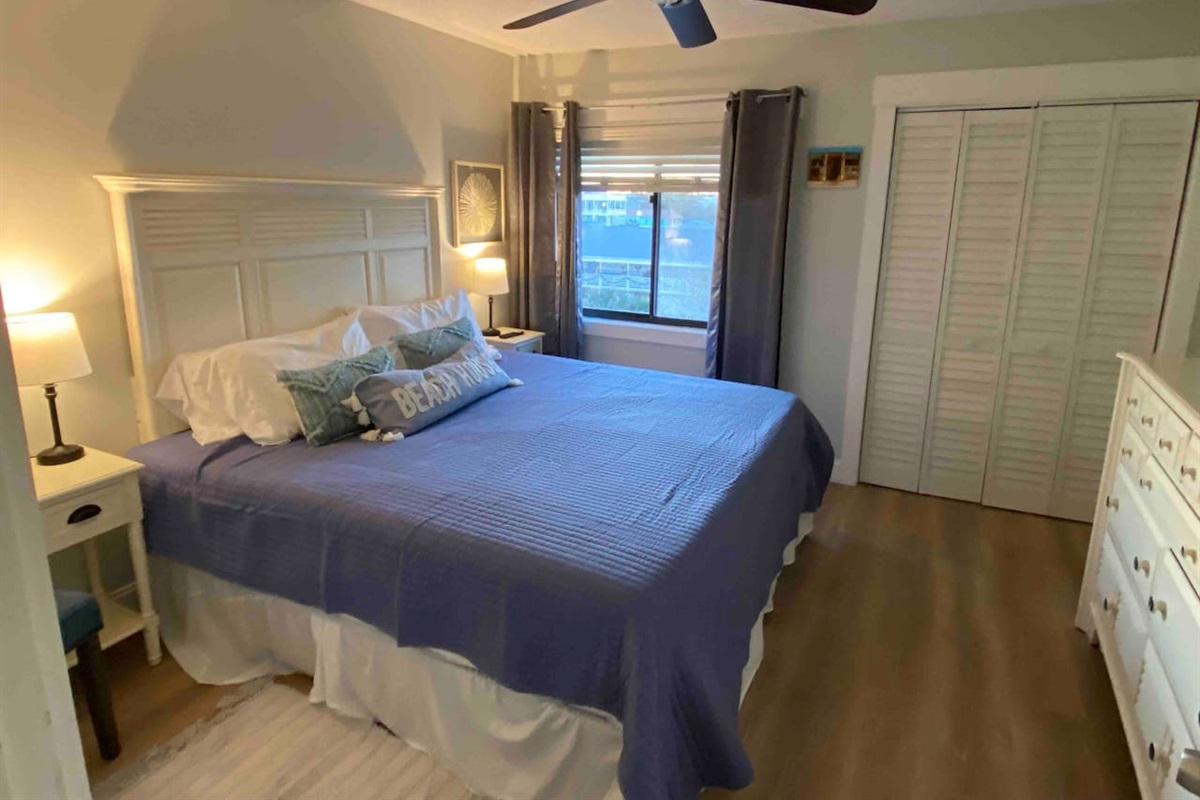 Cozy king bed with new mattress. 