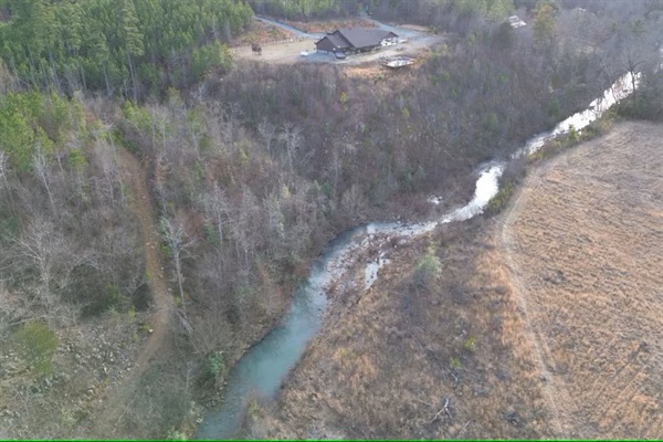Winter aerial showing the river gently circling the island below the cabin.