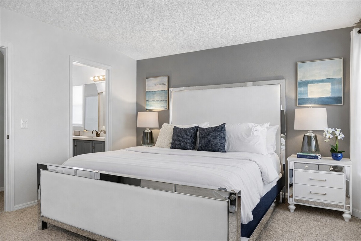 KING master bedroom with a pillowtop mattress, comfortable bedding  and soft lighting for a relaxing stay