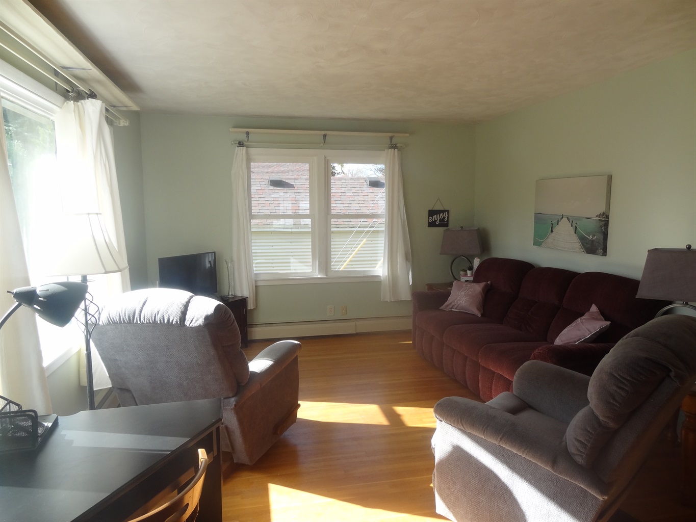 Full size couch, 2 recliners, Roku smart TV, laptop work space