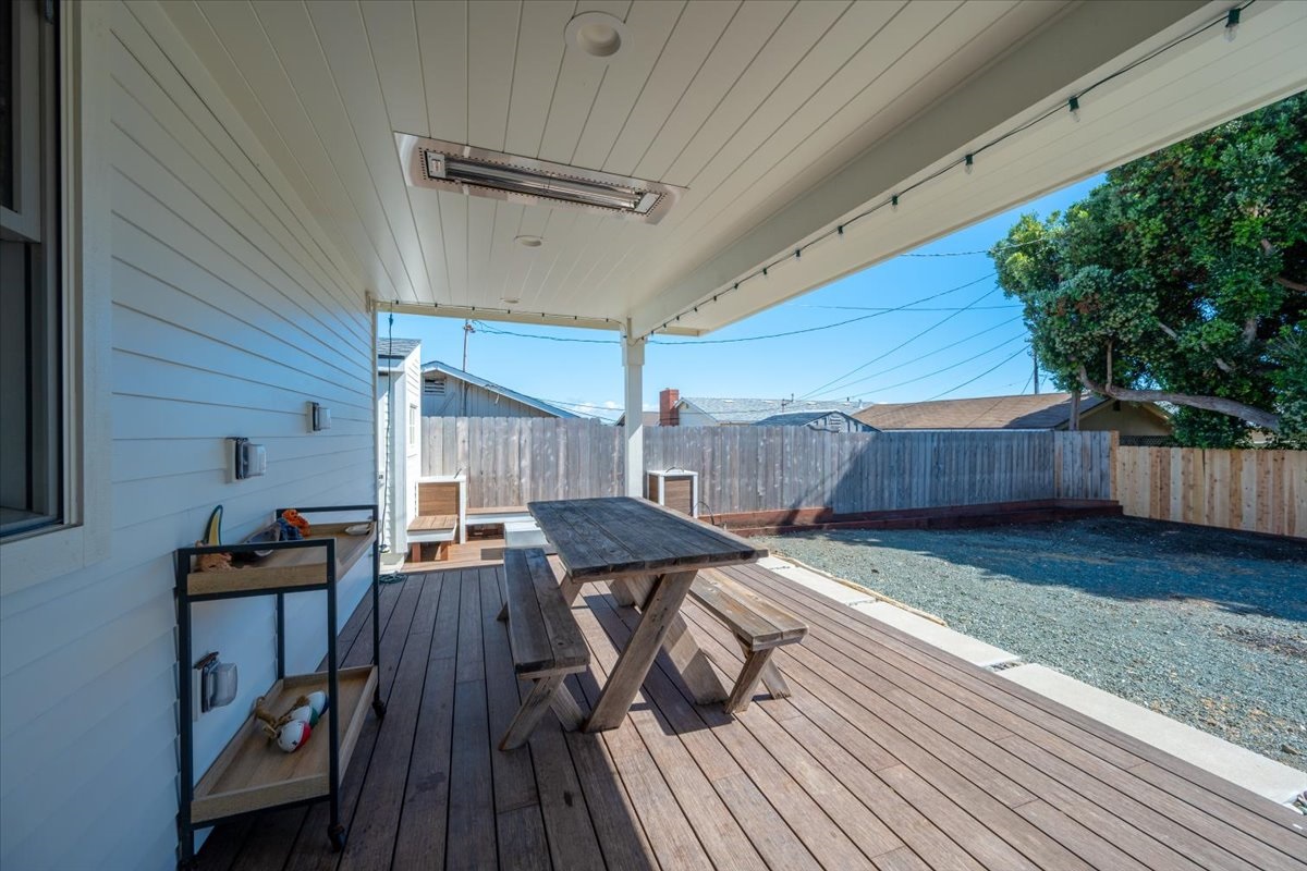 Back porch with heater for outdoor comfortable dining.