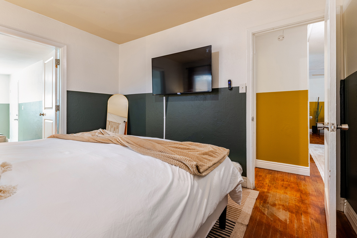 Bright colors and a TV create a stylish escape for your Austin adventure!