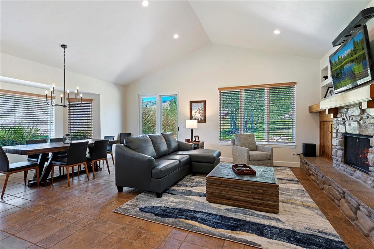 Unwind by the fireplace after a full day of adventure, with plenty of space to relax, recharge, and enjoy the company around you.