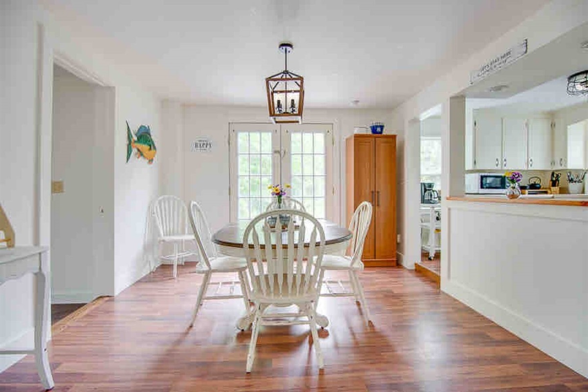Dining room table - can expand to seat up to 6 chairs. There are also 2 additional bar stools in the kitchen for seating up to 8 people. Not to mention the outdoor tables which is where you will really want to be 