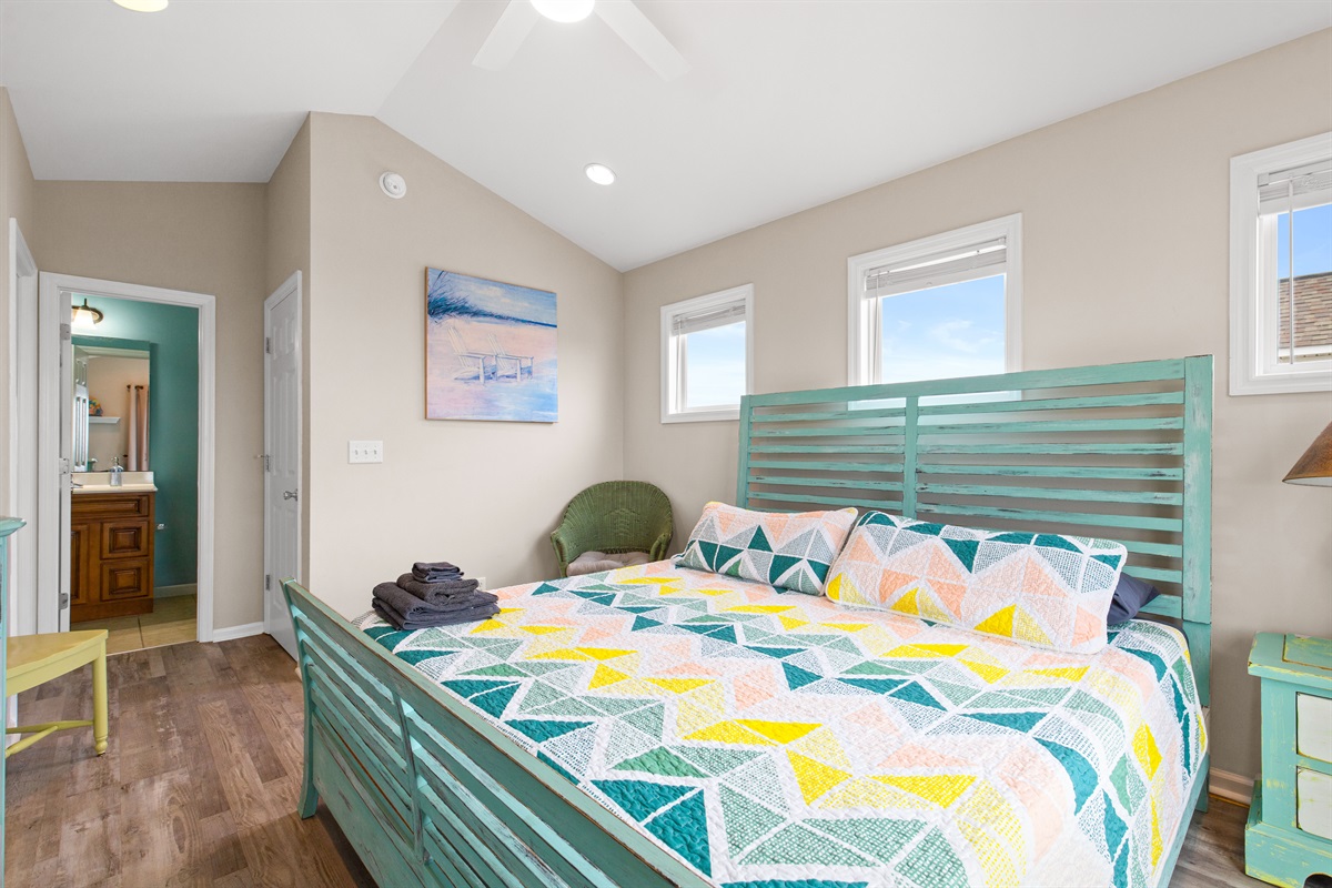 Spacious master suite with vaulted ceilings and airy beach-house feel