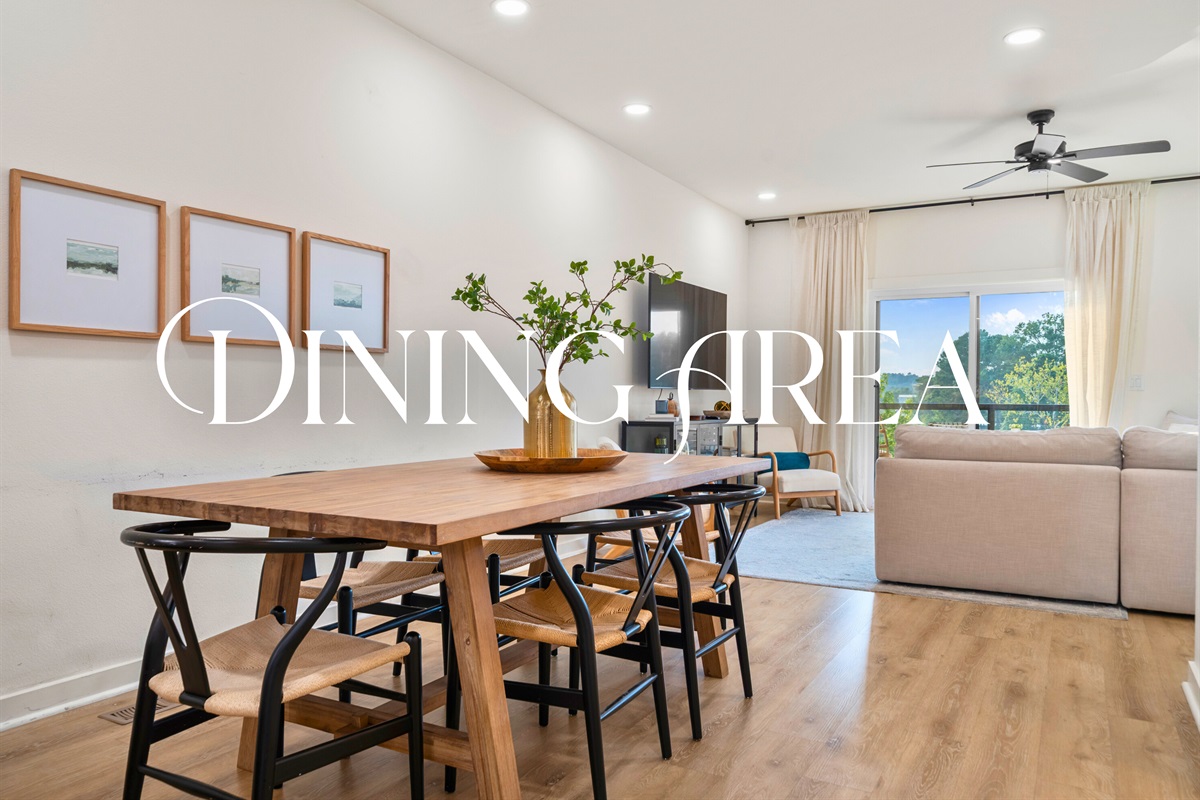 Dining area with seating for six and access to the balcony.