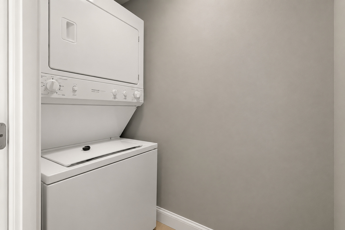 Laundry facilities connected via a closet in the kitchen.