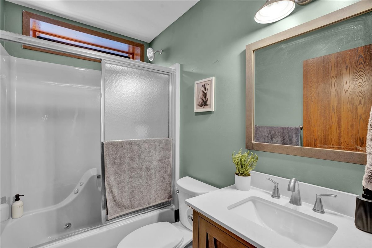 “Lower bathroom with modern fixtures and plenty of light.”