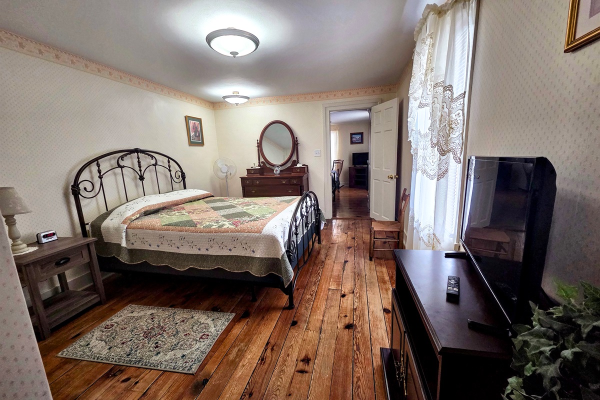 Second Upstairs bedroom featuring a comfortable full bed, with convenient access to the shared Jack-and-Jill bathroom.