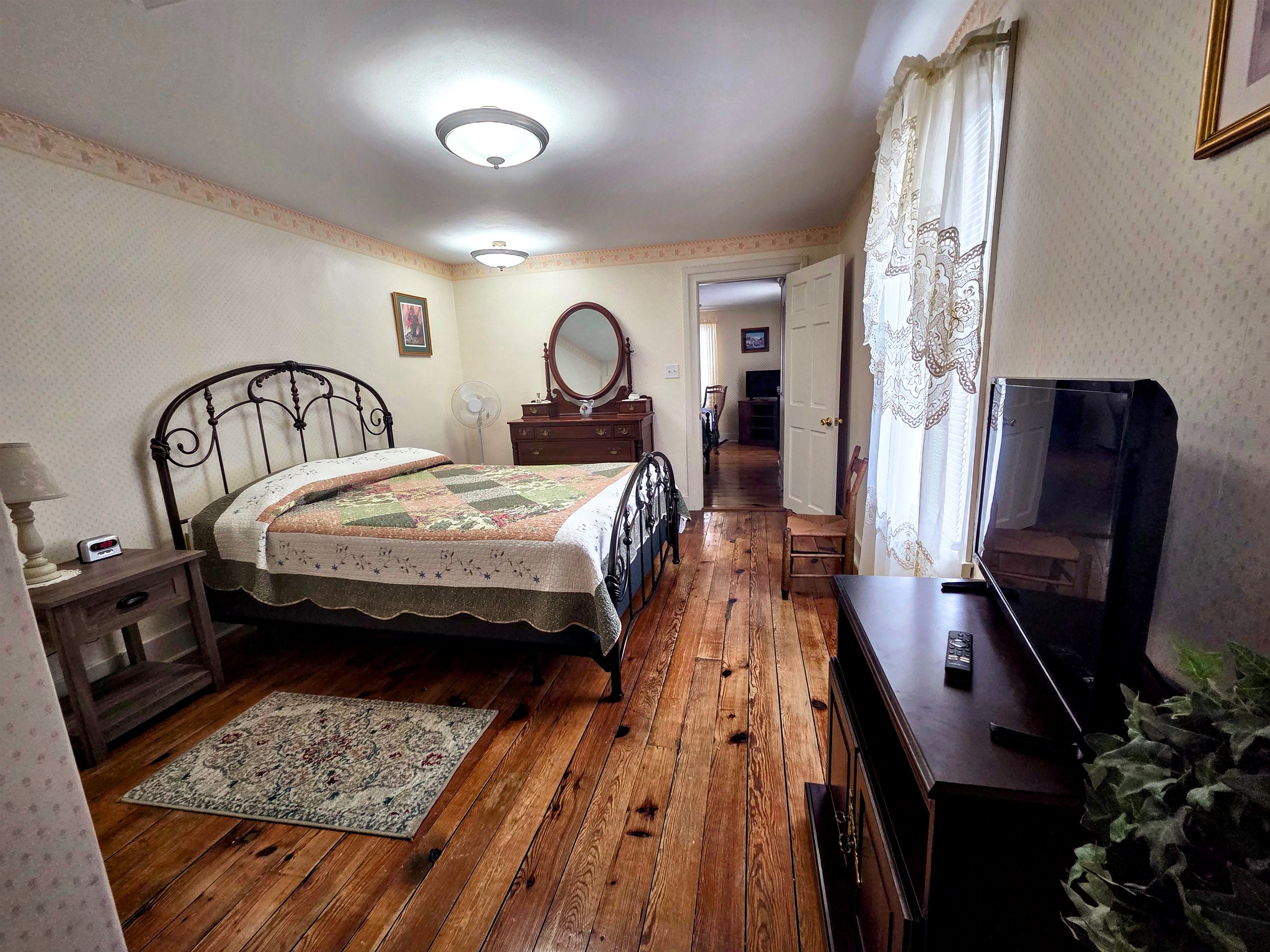 Second Upstairs bedroom featuring a comfortable full bed, with convenient access to the shared Jack-and-Jill bathroom.