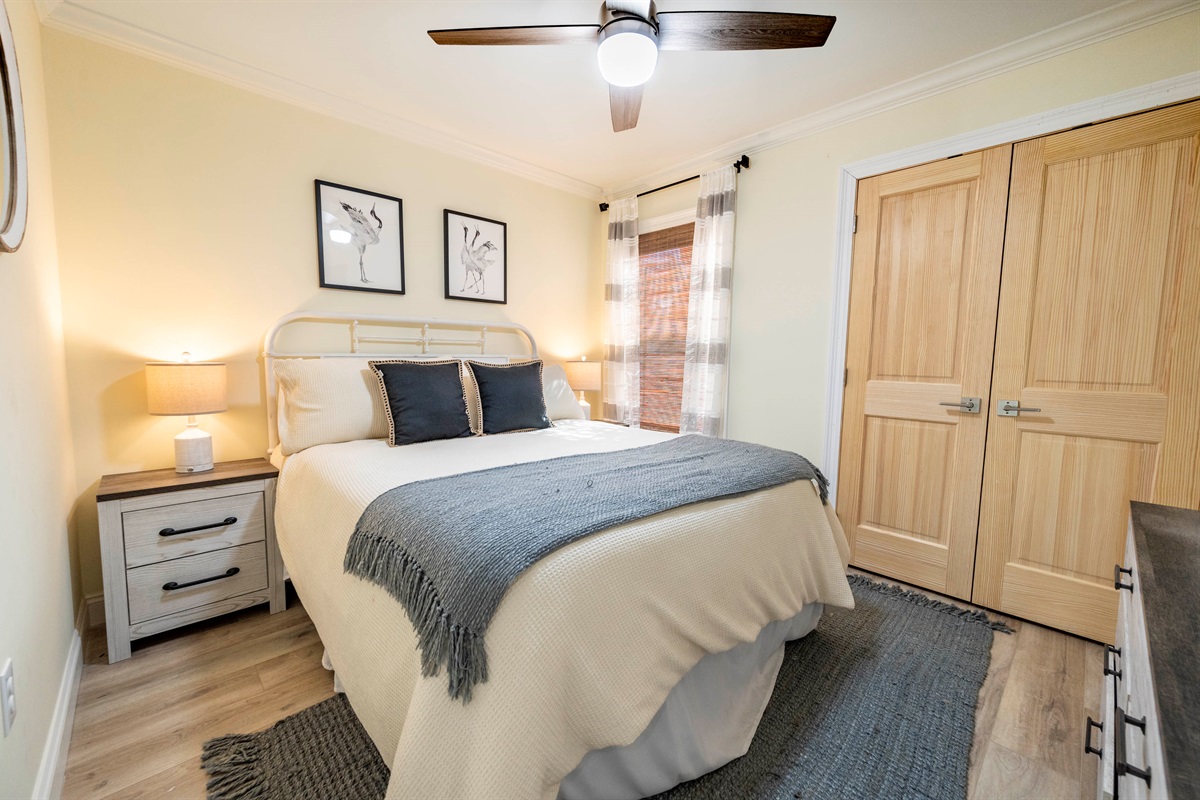 Cozy bedroom retreat with warm lighting, soft bedding, and modern décor.