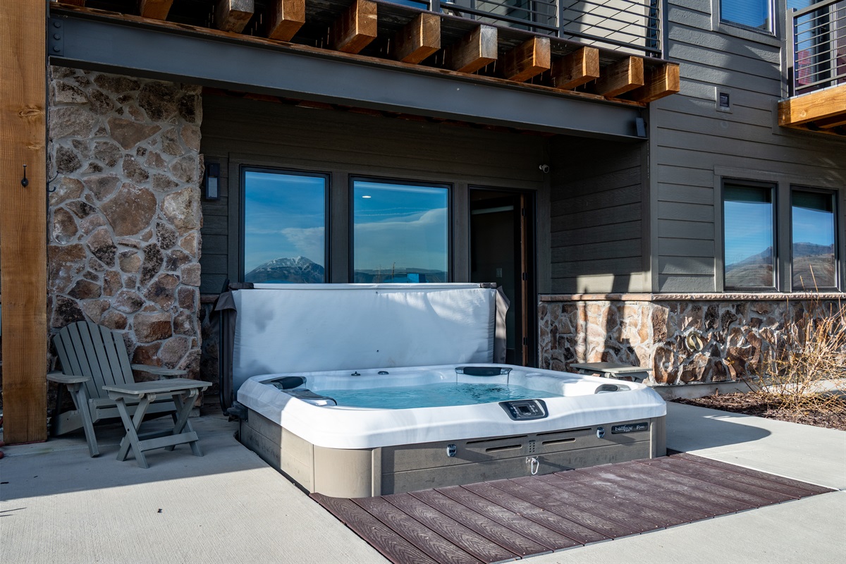 Private patio with hot tub—perfect for year-round relaxation