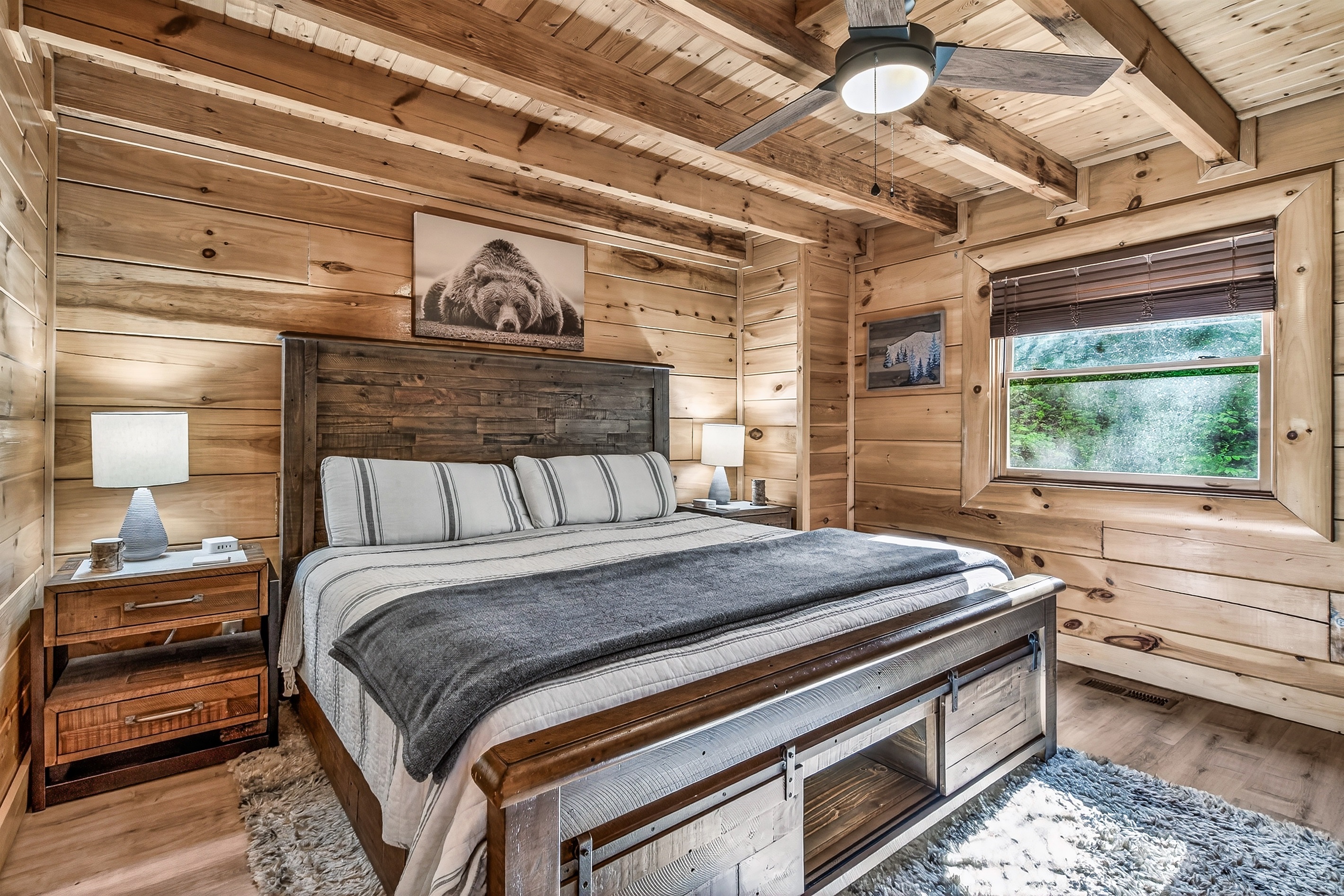 King bed in the back bedroom.  Bedroom includes an en suite bathroom.