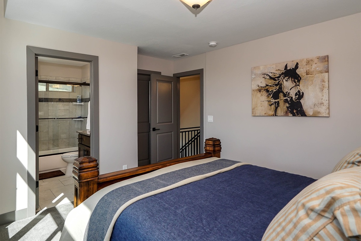 Bright upper-level queen bedroom with ensuite.