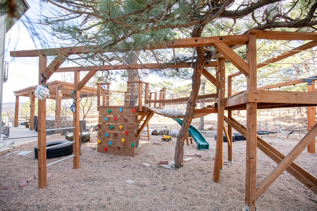 Climb, slide, and explore in our custom playground built around a beautiful mature tree. Kids will love the climbing wall, bridge, monkey bars, and slide—creating the perfect backyard adventure right outside the cabin.