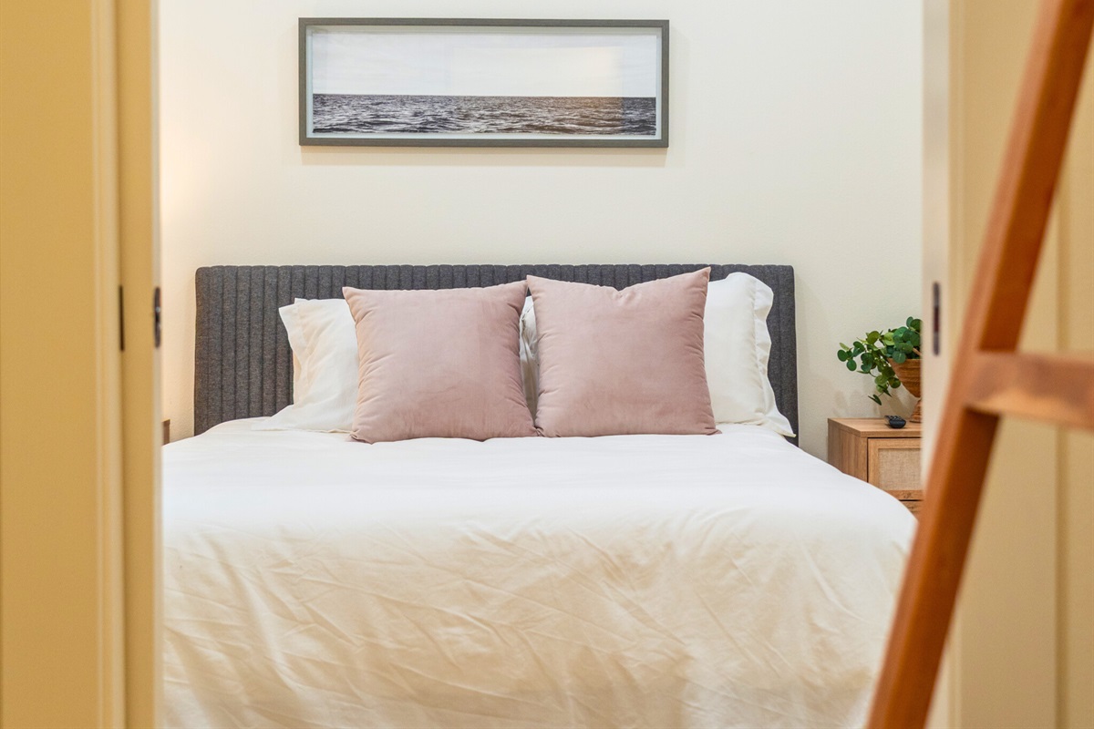 Comfortable bedroom with plush bedding and thoughtful design.