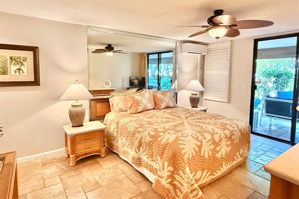 Main Bedroom - King bed, tv, and airy island decor. Wake up to gentle breezes and soft natural light for the perfect start to your day in paradise