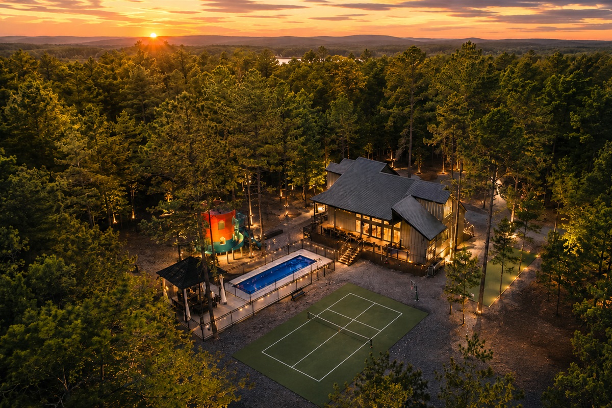 Outdoor Paradise: Serenity awaits with stunning views, a sparkling pool, and fun in the woods!