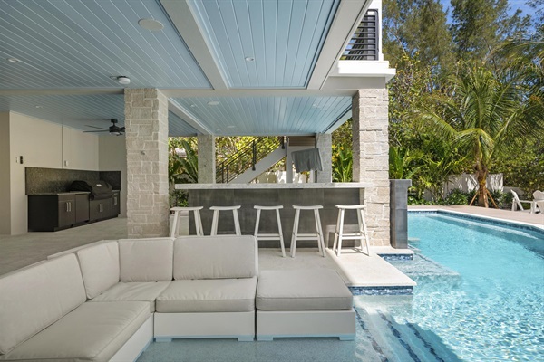 Pool area with outdoor kitchen