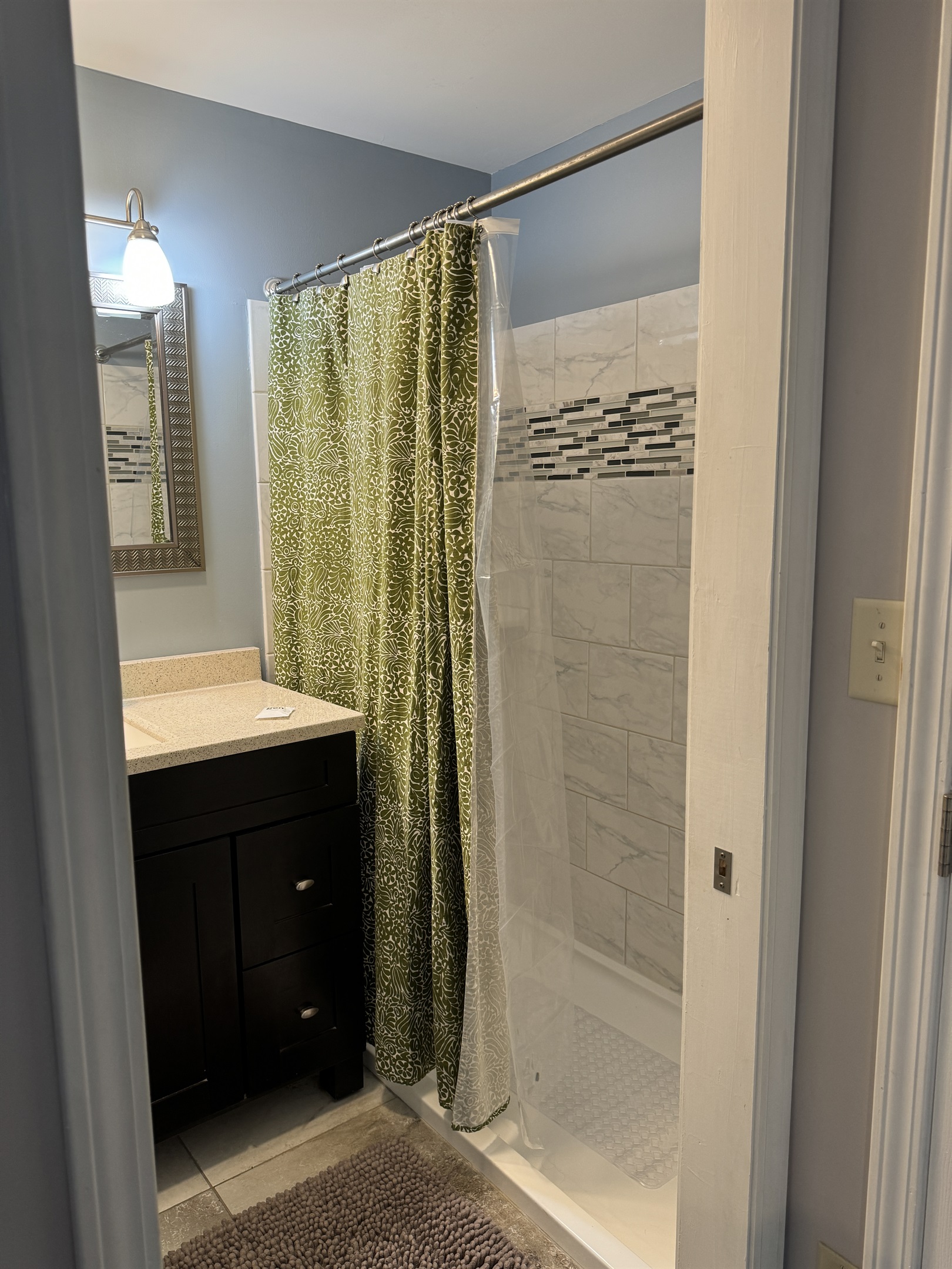 1st floor primary ensuite bathroom with wide shower