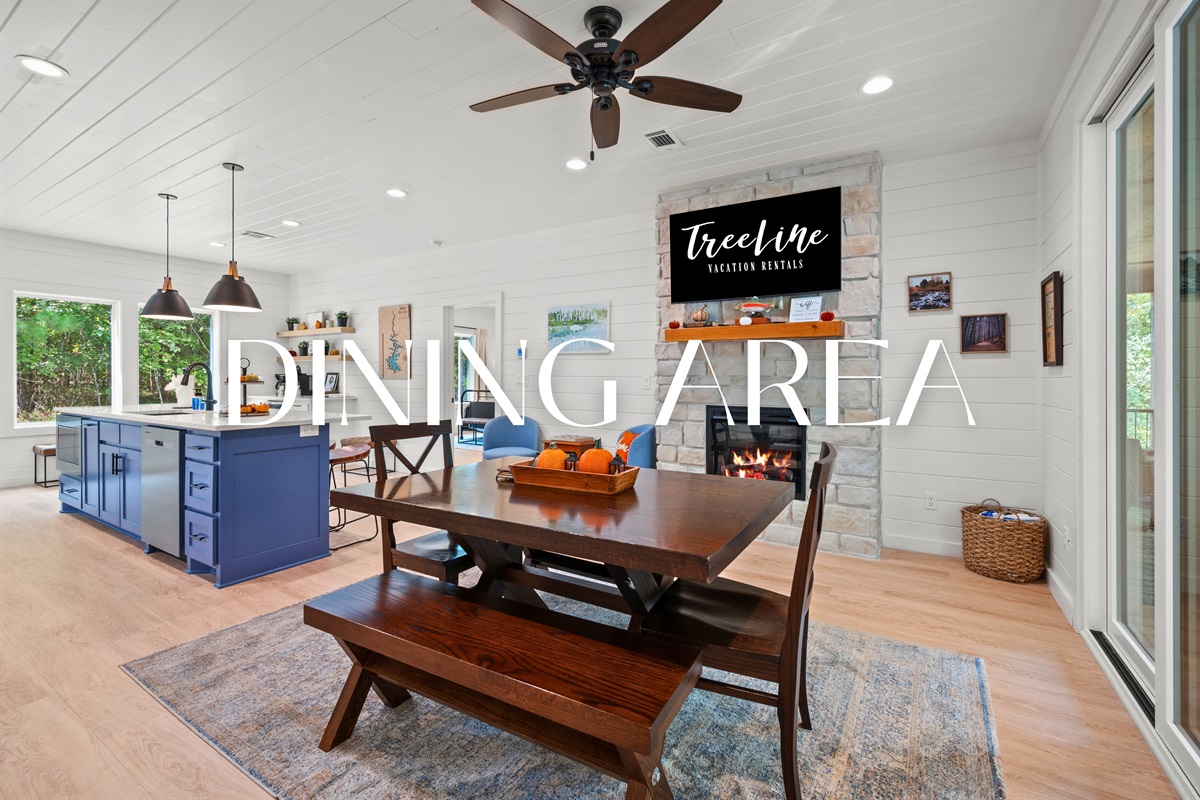 Dining area with seating for six and access to the deck.