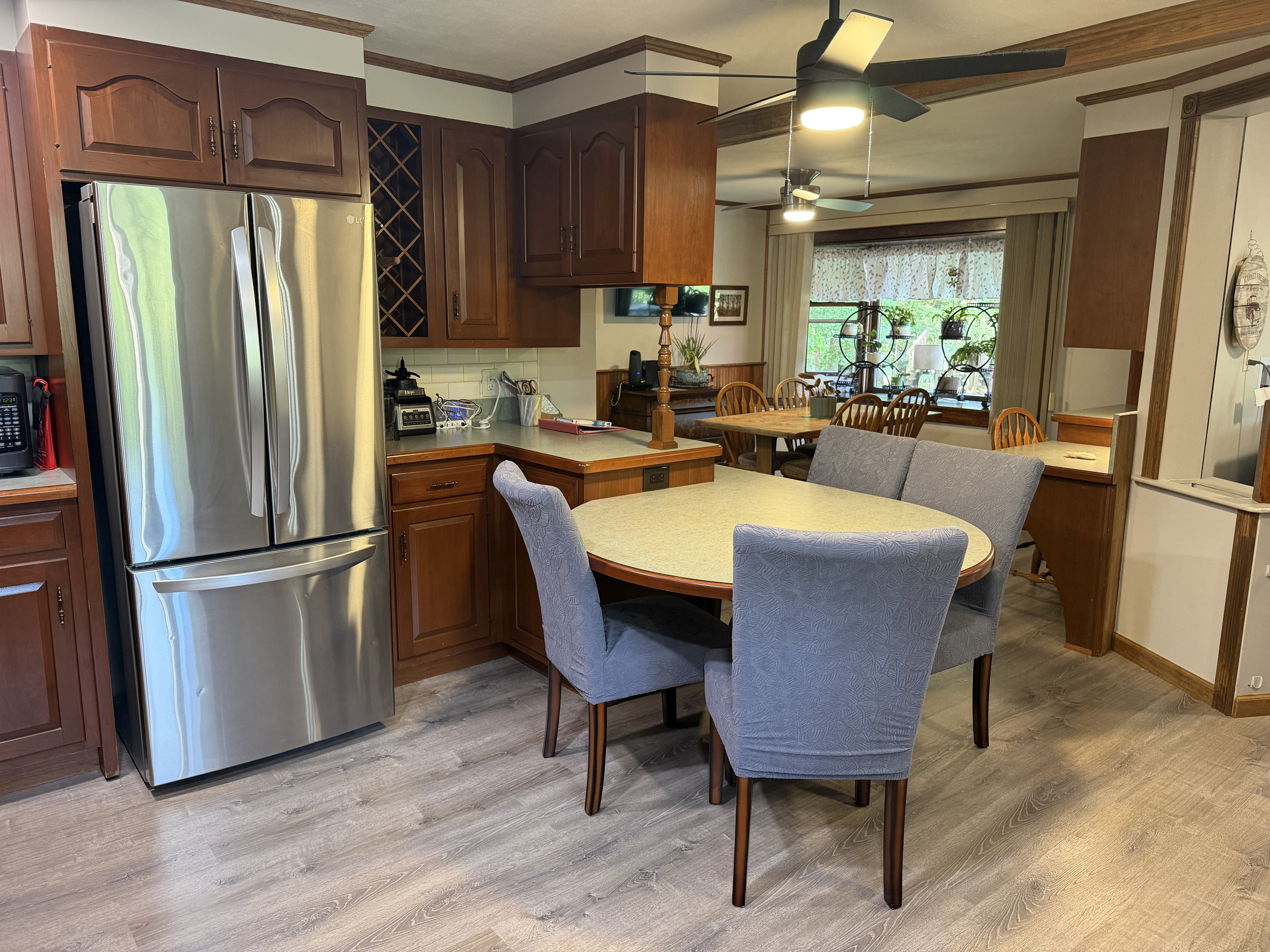 Kitchen with breakfast nook and dining area beyond
