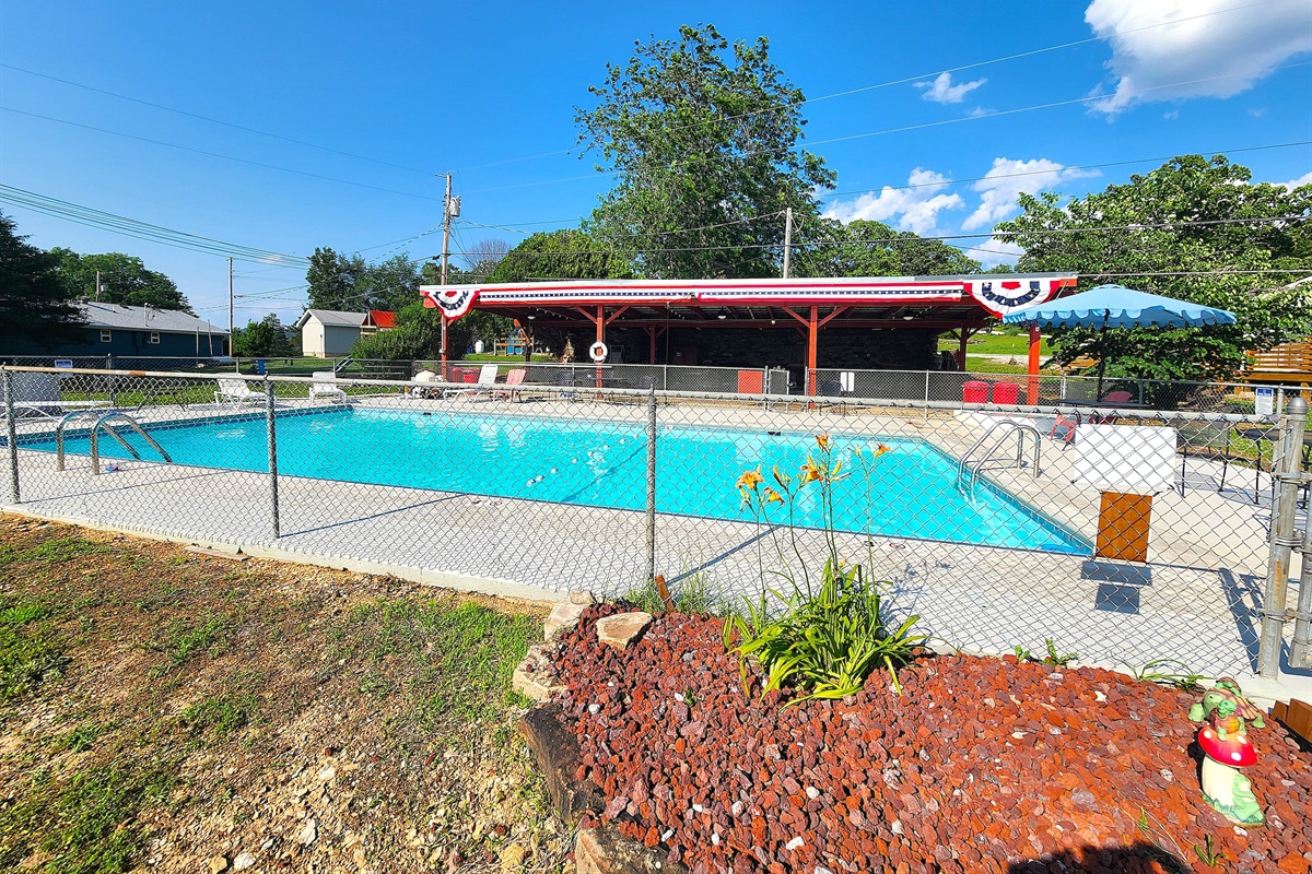 The inground pool is very large and features all new paint inside and on the pool deck.