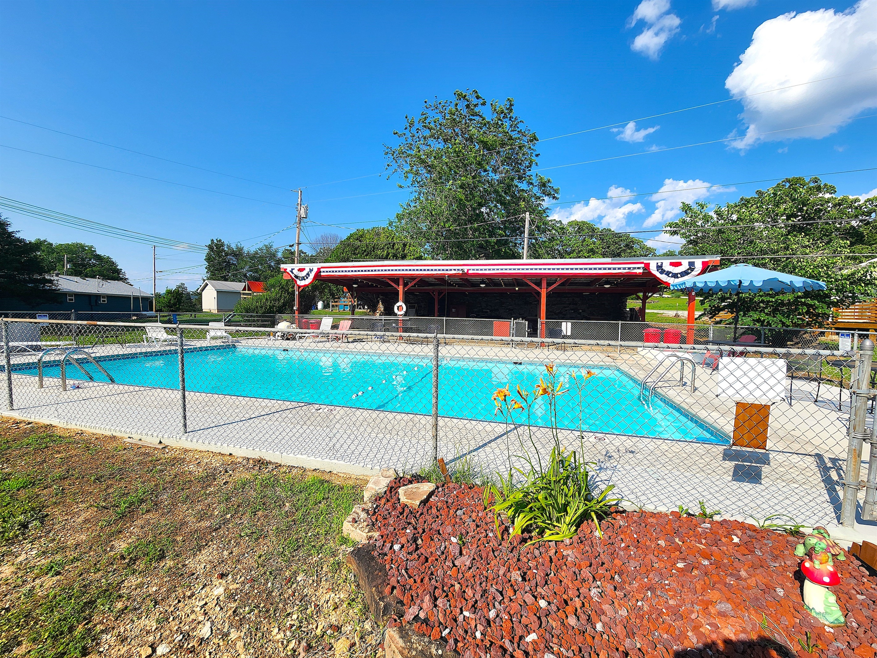 The inground pool is very large and features all new paint inside and on the pool deck.