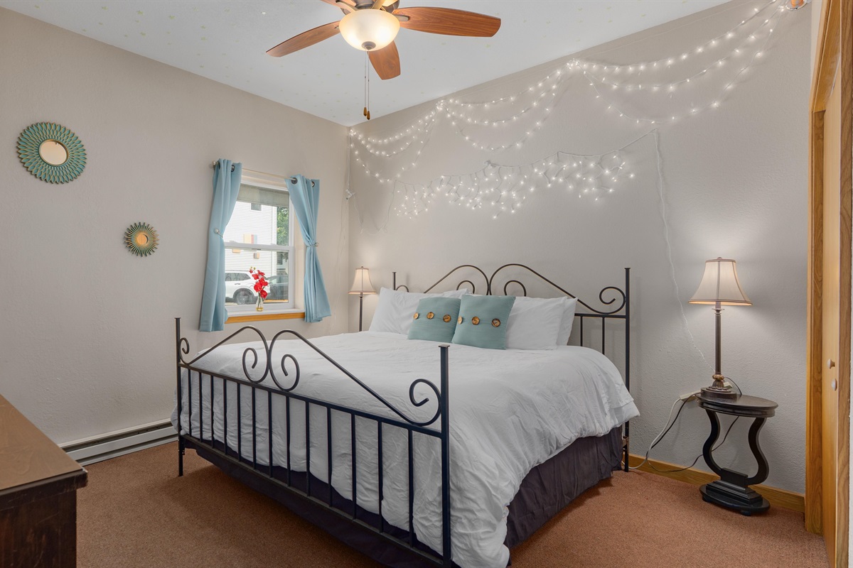 Starshine offers a comfortable king bed and subtle glowing stars overhead!