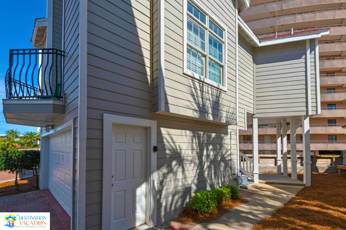 A charming coastal home surrounded by vibrant surroundings.