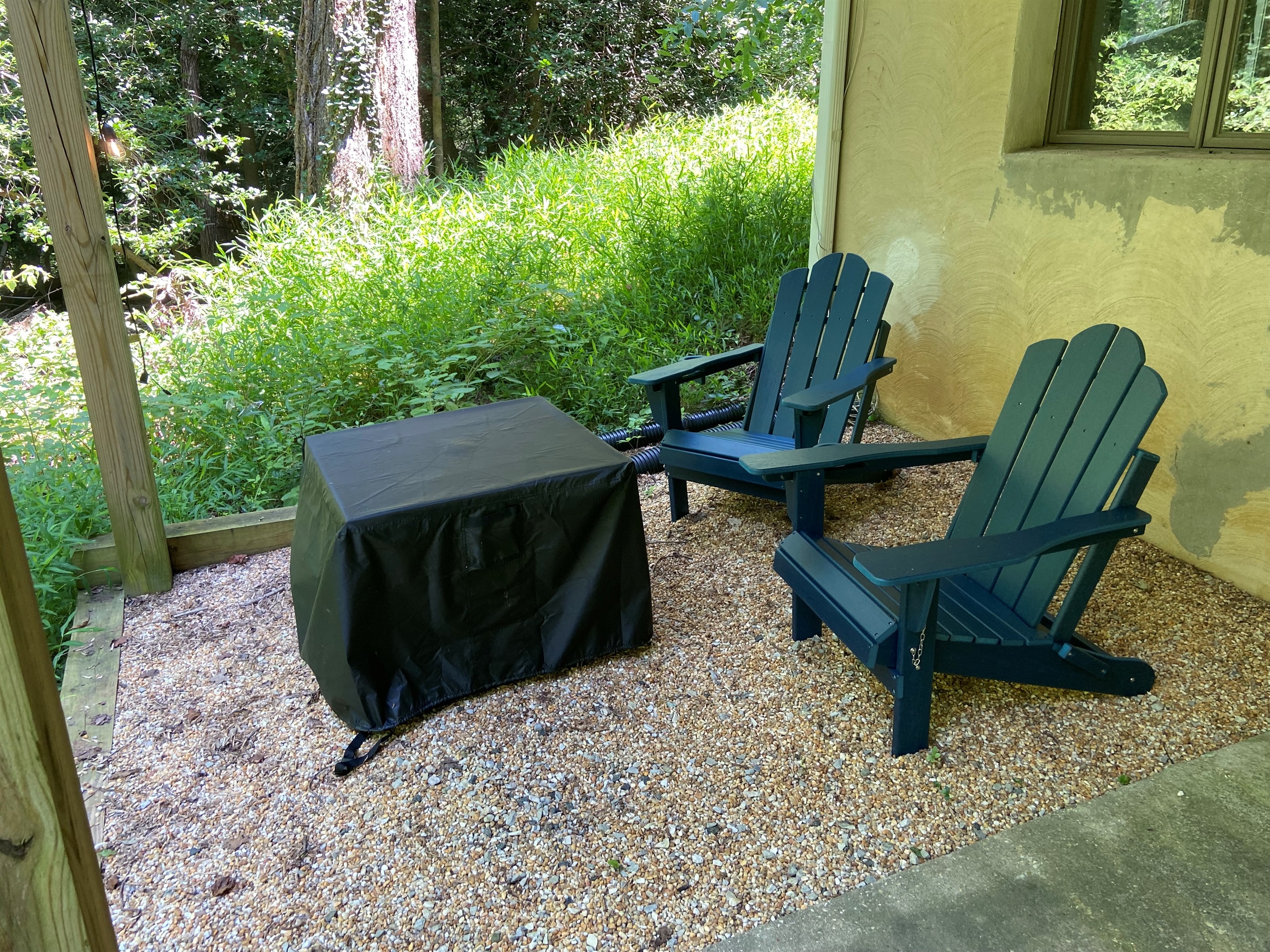 Fire pit and Adirondack chairs (+ additional bench is nearby for more outdoor seating)