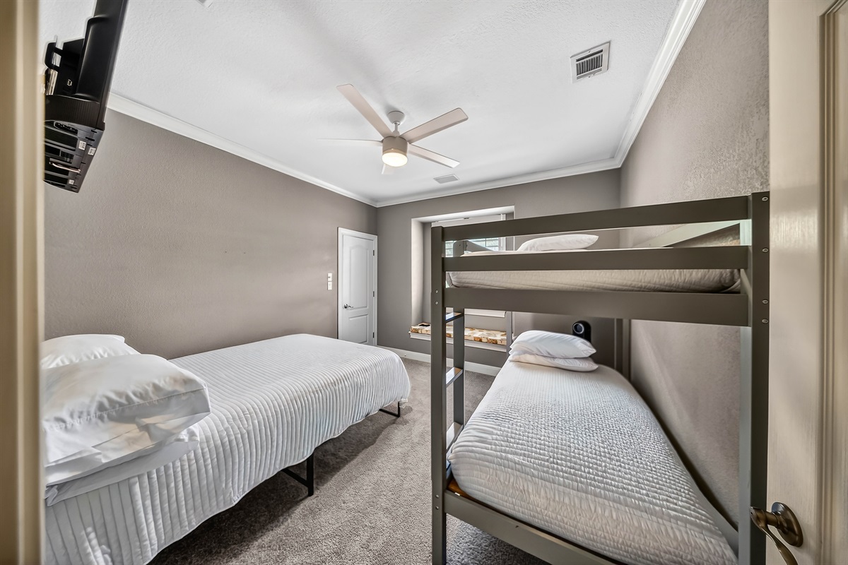 Fun and functional bunk room with twin over twin bunks and an additional queen bed. Perfect for groups or families, complete with a TV for winding down after a full day on the lake.