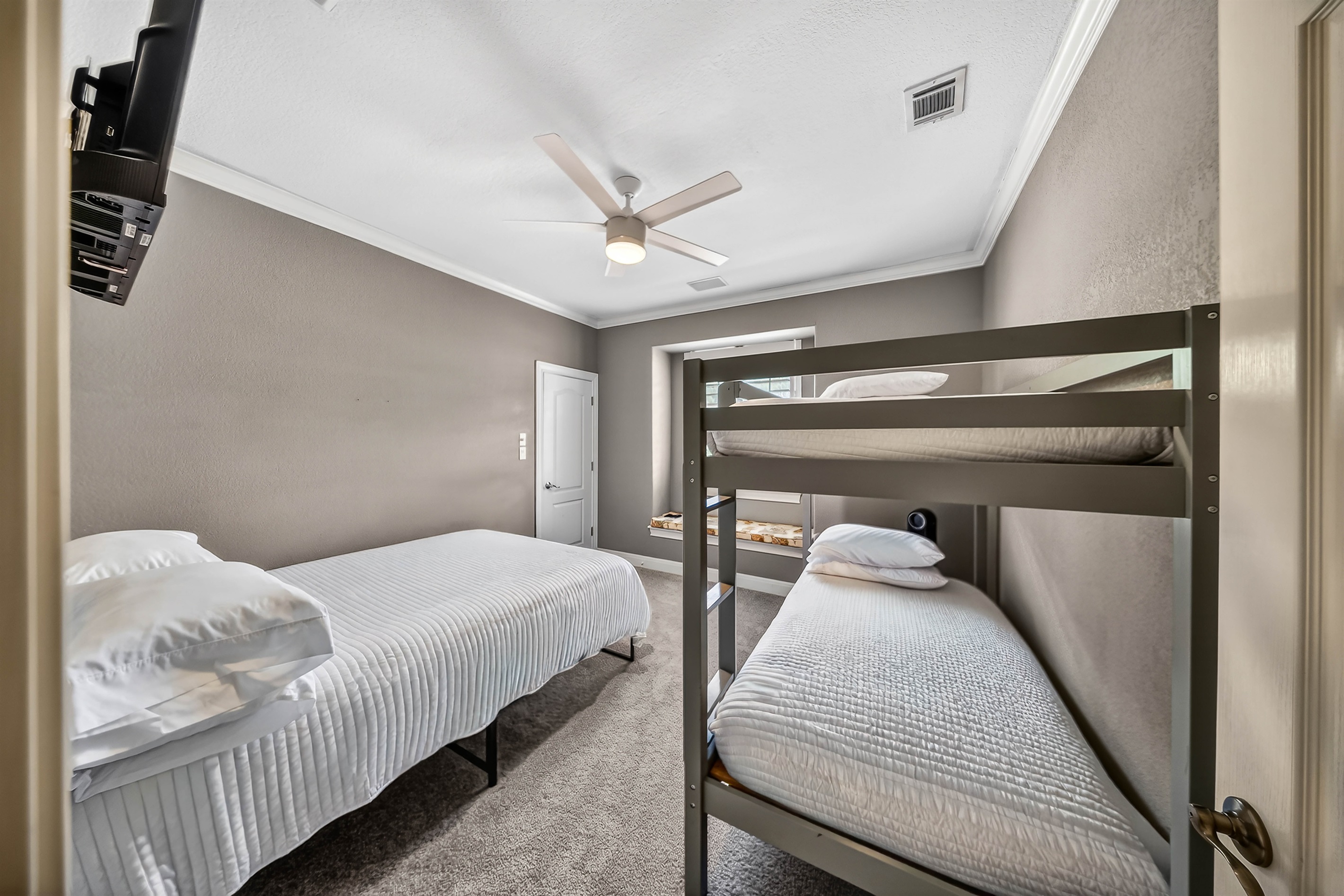 Fun and functional bunk room with twin over twin bunks and an additional queen bed. Perfect for groups or families, complete with a TV for winding down after a full day on the lake.