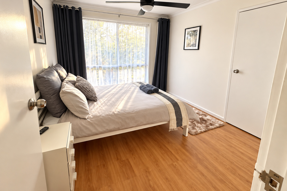 Rest and recharge at Carlenes Getaway in this peaceful bedroom, complete with a comfortable queen bed, fresh linens and plenty of natural light.