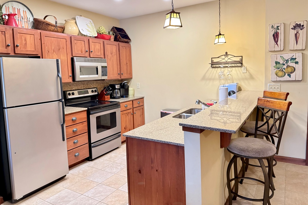 Full kitchen and bar seating