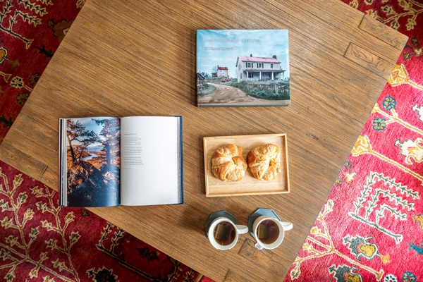 Slow mornings done right — hot tea, fresh pastries, and a good book while the house wakes up around you.