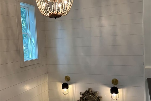 Staircase down to living, dining and kitchen areas