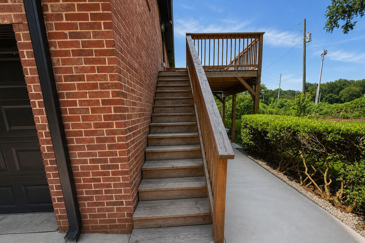 Up the stairs is the back entrance (also a seating area)