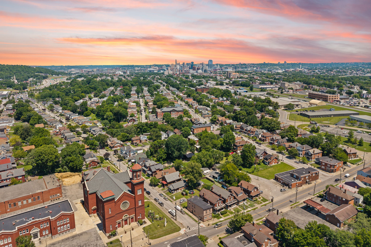 Stunning golden-hour aerial view of the Highland Pike neighborhood at sunset