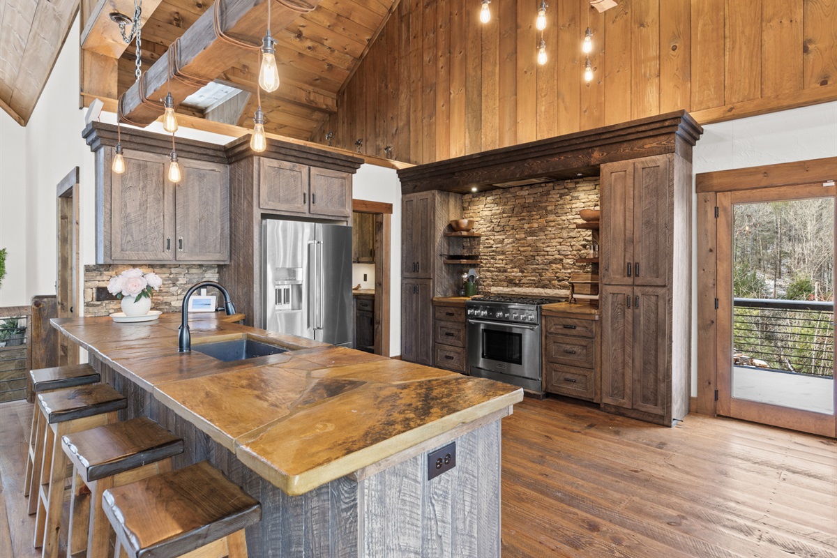 This spacious kitchen combines rustic charm with modern conveniences, making meal prep enjoyable for any occasion.