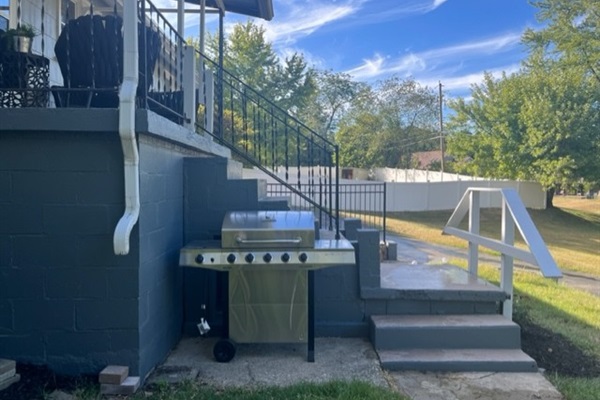 Outdoor grill and backyard access