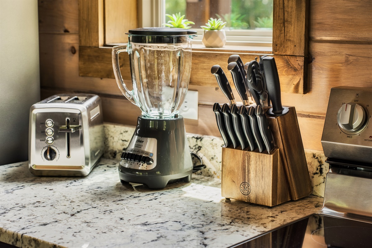 Fully stocked kitchen with pots, pans, rice cooker, blender, Toaster, crockpot, Keurig coffee machine and drip coffee machine