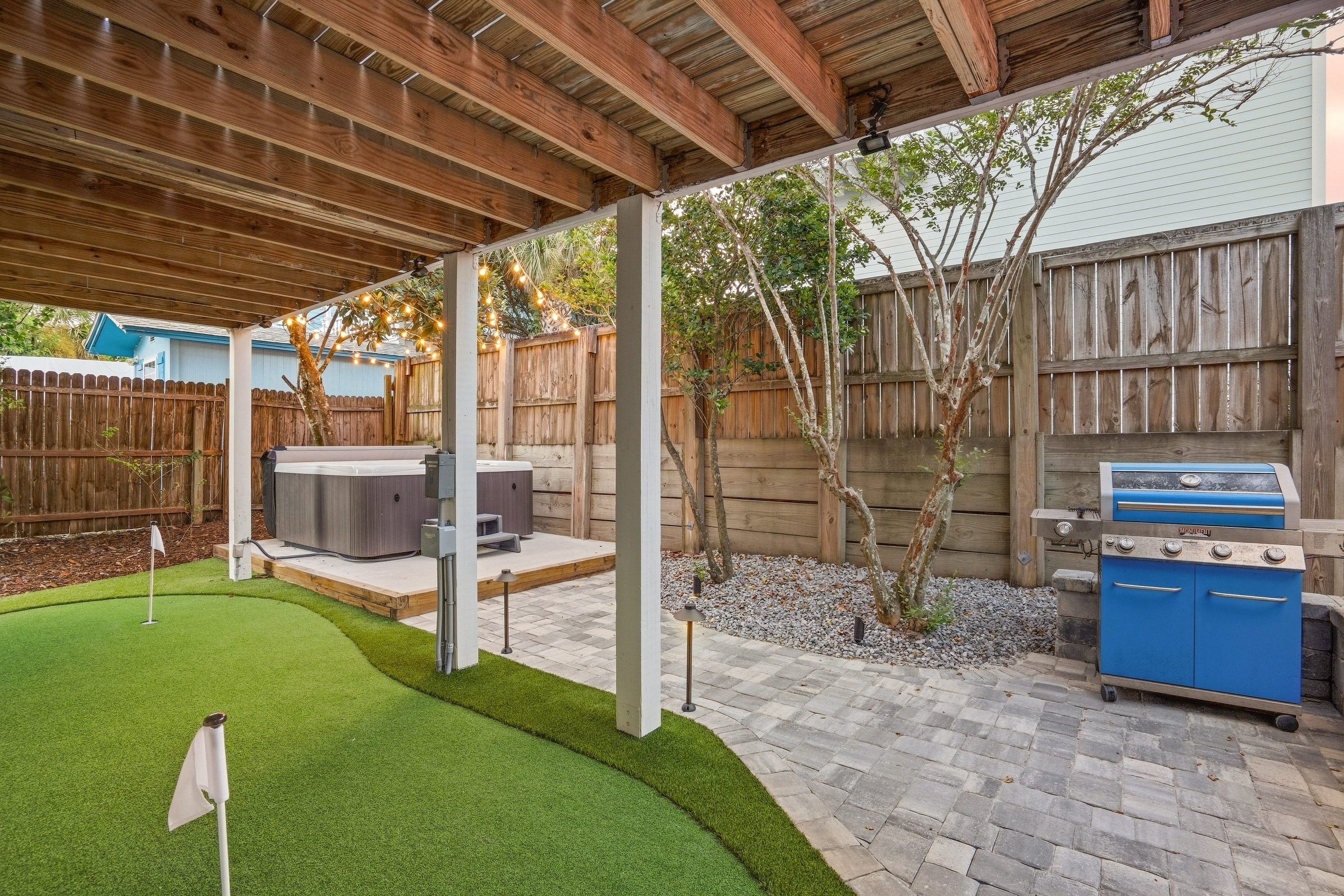 Hot tub, outdoor TV, and your own putting green—pick your favorite way to unwind in this private backyard.