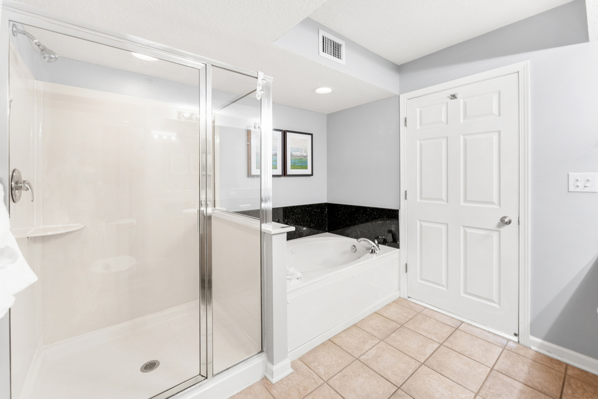 Main bathroom with double sinks, jetted tub and stand alone shower