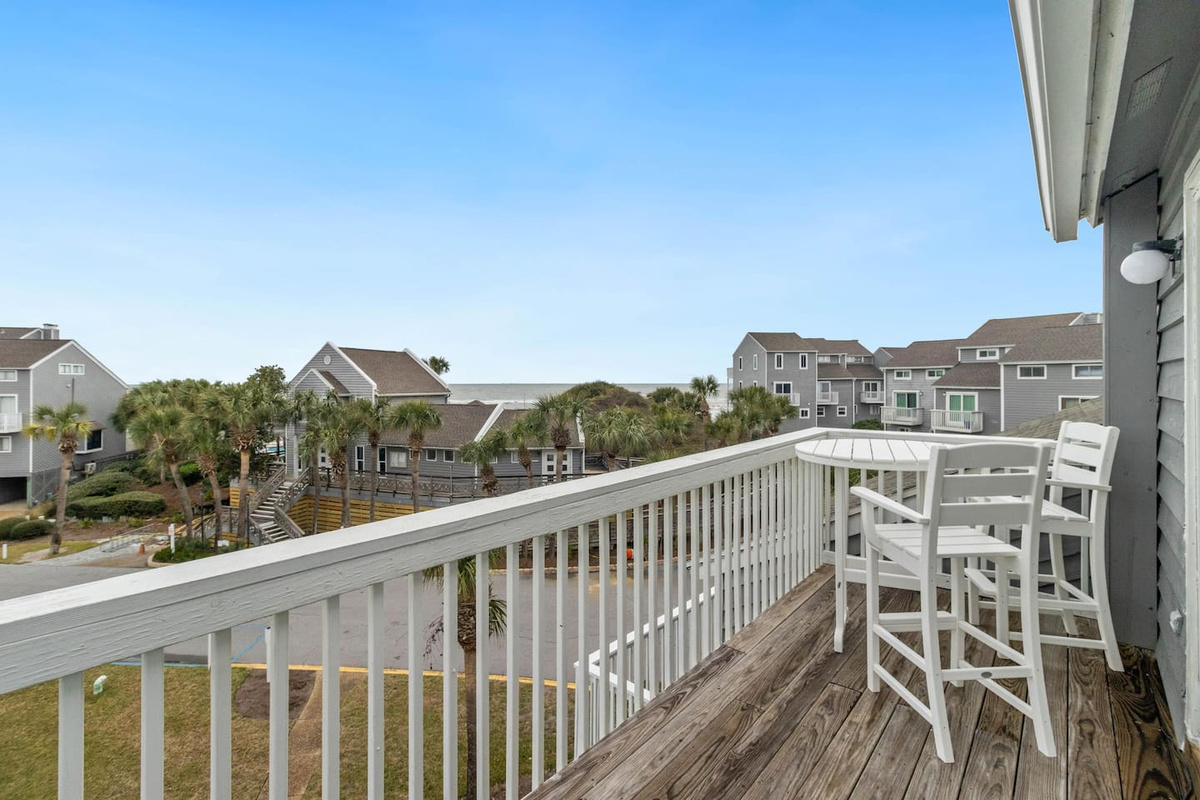 Settle into the bistro set with your evening drink &mdash; the Gulf sunset starts right on schedule.