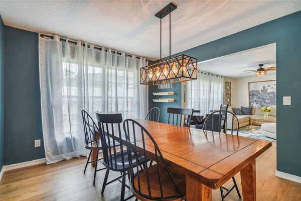 The dining room has seating for eight, plus seating for six more at the built-in table in the adjacent kitchen.