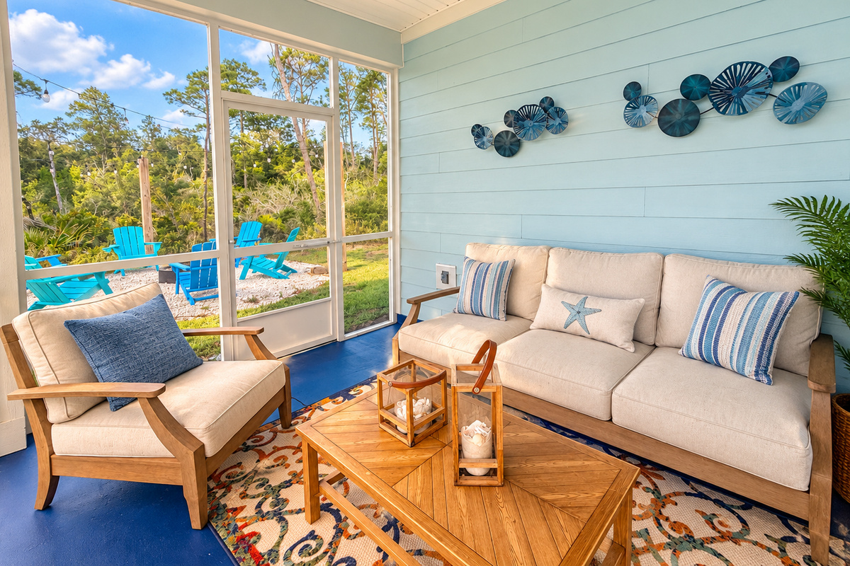 Screened-in back porch with outdoor seating—enjoy evenings bug-free.