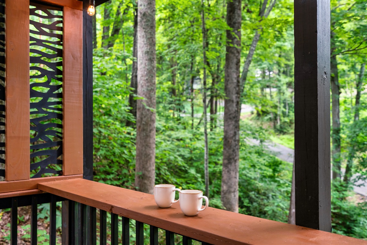 Hot tub deck looks out into the serene forest